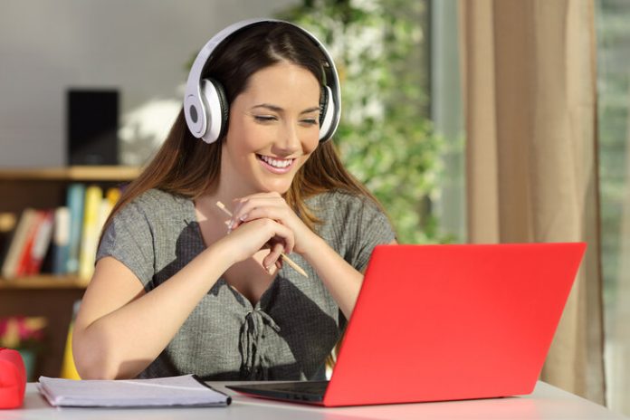 Student Watching Video Tutorials On Line